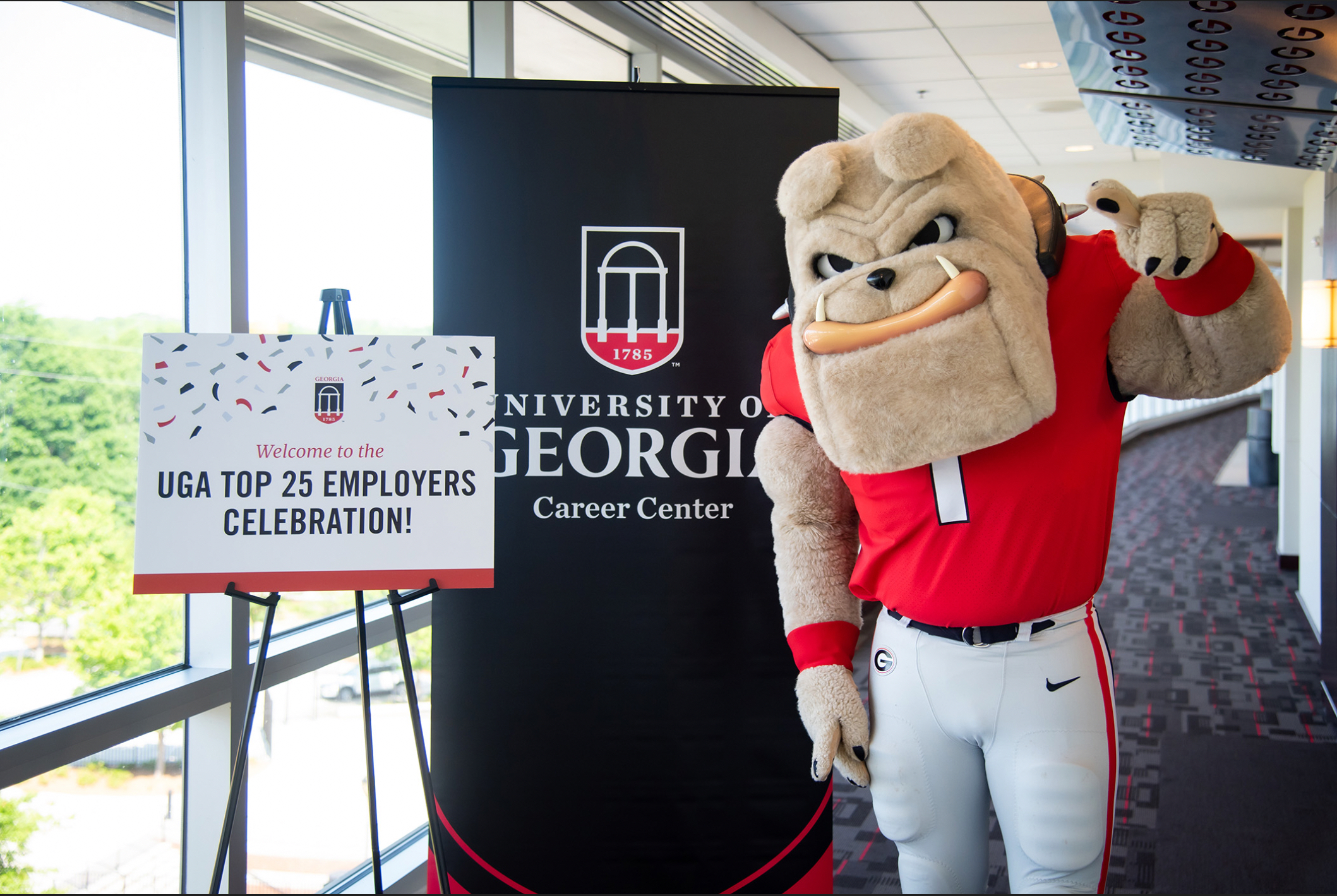 UGA mascot at career fair with students and employers networking